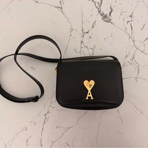 Elegant Black Crossbody Bag with Heart Accent